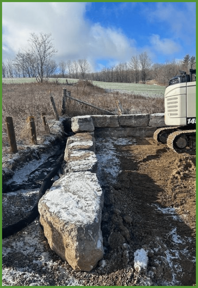 Armour stone retaining wall