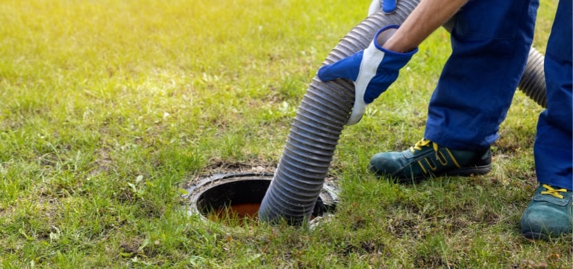 guy operating septic pumping